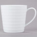 A white 10 Strawberry Street Swing porcelain mug with a handle.