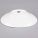 A white 10 Strawberry Street Whittier shallow oval porcelain bowl on a gray surface.
