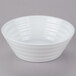 A white 10 Strawberry Street Swing porcelain cereal bowl with a spiral design.
