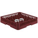 A Vollrath red plastic dish rack with two glass jars inside.