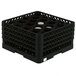 A black plastic Vollrath Traex rack with 20 compartments for glasses.