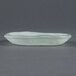 A white opal glass eliptical dish with a curved edge.