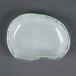 A white opal glass eliptical dish with a small hole in the middle.