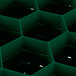 A green plastic container with a hexagonal grid of holes.