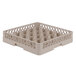 A Vollrath beige plastic glass rack with 25 compartments.