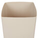 A beige square rigid plastic liner for a waste container.
