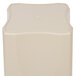 A beige square plastic container with a square top.