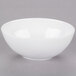 A white 10 Strawberry Street Royal porcelain bowl with a white rim on a gray surface.