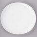 A white porcelain oval plate with a white rim.