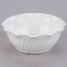 A white Cambro plastic bowl with a wavy edge.