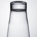 An Arcoroc Shetland highball glass filled with a clear liquid.