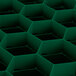 A green plastic grid with hexagons.