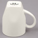 A white Tuxton Bistro China mug with a handle.