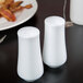 A table set with 10 Strawberry Street Aurora Square white porcelain salt and pepper shakers.