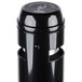 A black Rubbermaid cigarette receptacle with a white logo.