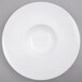A white porcelain bowl with a wide white rim.