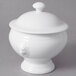 A white porcelain small lion headed tureen with a lid.