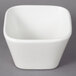 A case of 36 white square 10 Strawberry Street Whittier porcelain bowls on a gray surface.