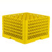 A yellow plastic Vollrath Traex glass rack with a grid pattern.
