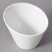 A white porcelain tall slant bowl with a small opening.