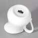 A white porcelain jug with a handle.