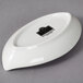 A white oval shaped 10 Strawberry Street porcelain dish.