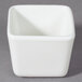 A 10 Strawberry Street Whittier white square tid bit bowl on a gray surface.