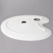 A white porcelain oval painters easel with a round hole.