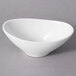 A 10 Strawberry Street Whittier white porcelain oval bowl with a curved edge.