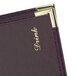 A purple leather Menu Solutions Royal Select Series booklet menu cover on a table.