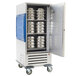 A large metal refrigerated cabinet with adjustable slides holding silver bowls.