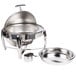 A Vollrath stainless steel round chafer with a lid.