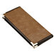A brown leather Menu Solutions Royal Select menu cover with black corners on a table in a bar.