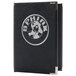 A black leather Menu Solutions menu cover with a silver logo.