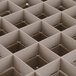 A Vollrath Traex beige 36-compartment glass rack grid.