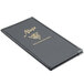 A black Menu Solutions Royal Select leather-like menu cover with gold writing on a table.