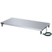 A white rectangular stainless steel Hatco heated shelf on a rectangular silver table with a black power cord.