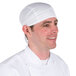 A man wearing a white Headsweats chef cap.