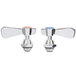 A white and chrome package with blue and chrome faucet valves.
