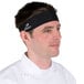 A man wearing a black Headsweats headband.