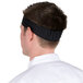 A man wearing a black Headsweats headband.