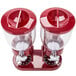 A red Zevro double dry food dispenser with clear containers and two red lids.