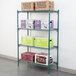 A Metroseal wire shelf with boxes on top.