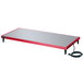 A red and grey rectangular Hatco heated shelf with a black cord.