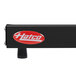 A black rectangular metal shelf warmer with a white and red Hatco logo.