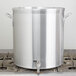A Vollrath Wear-Ever aluminum stock pot on a stove.