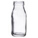 An American Metalcraft clear glass milk bottle with a cap.