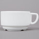 An Arcoroc white porcelain cup with a handle.