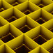 A close up of a yellow grid with squares.