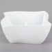 An American Metalcraft Prestige wave porcelain bowl on a gray surface.